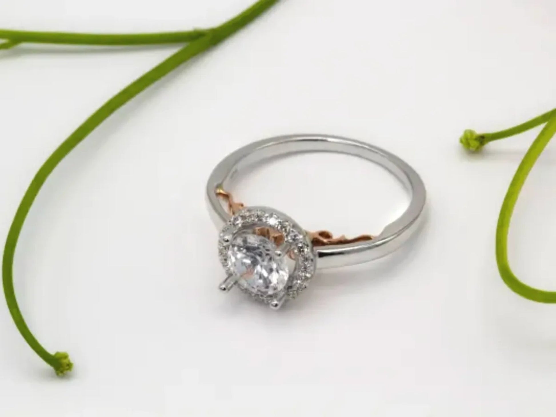 White and Rose Gold Halo Engagement Ring Gillespie Fine Jewelers